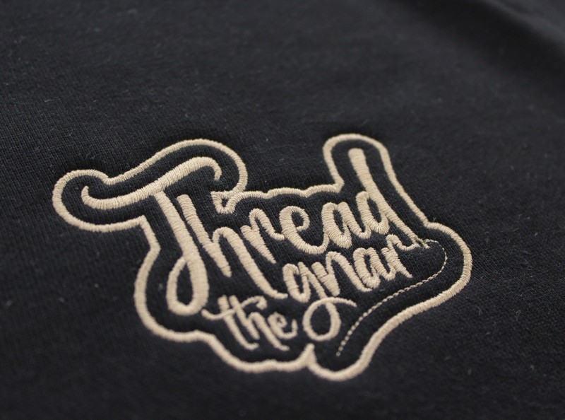 an image of the Thread the Gnar logo, in gold, sewn out onto a hat